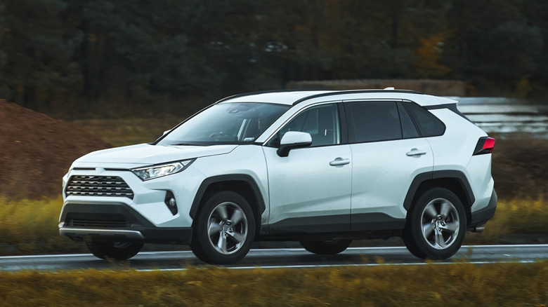 AWD car driving on a hillside road