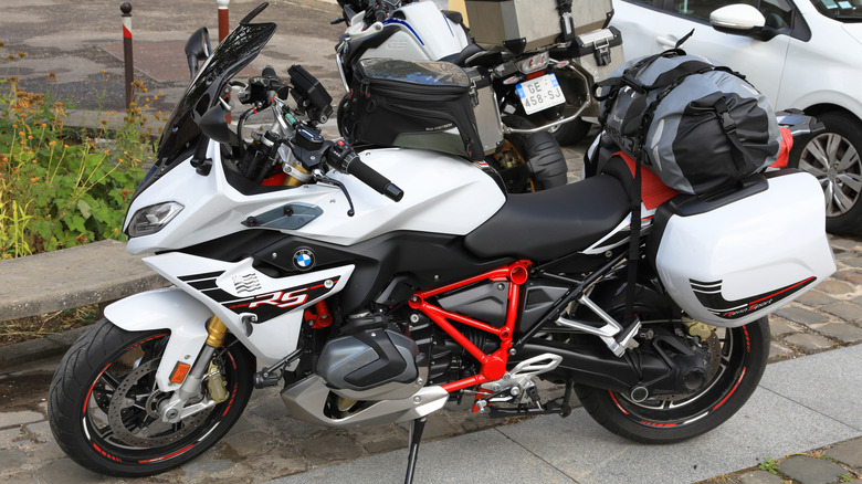 A BMW R1250RS parked near a wall