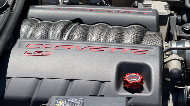 A close-up of a GM LS3 engine in a Corvette engine bay.