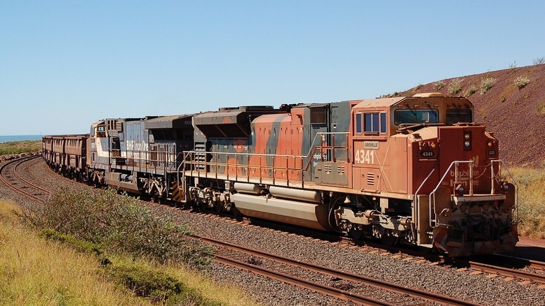 A BHP Iron Ore freight train turning a corner.