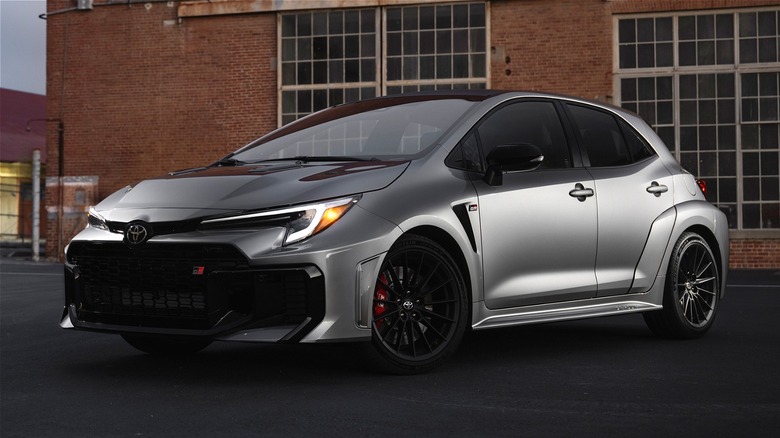Toyota GR Corolla parked in front of a building