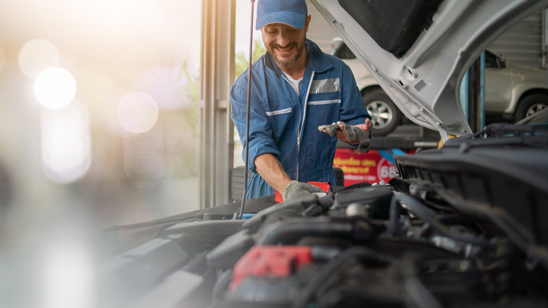 A mechanic working on a car
