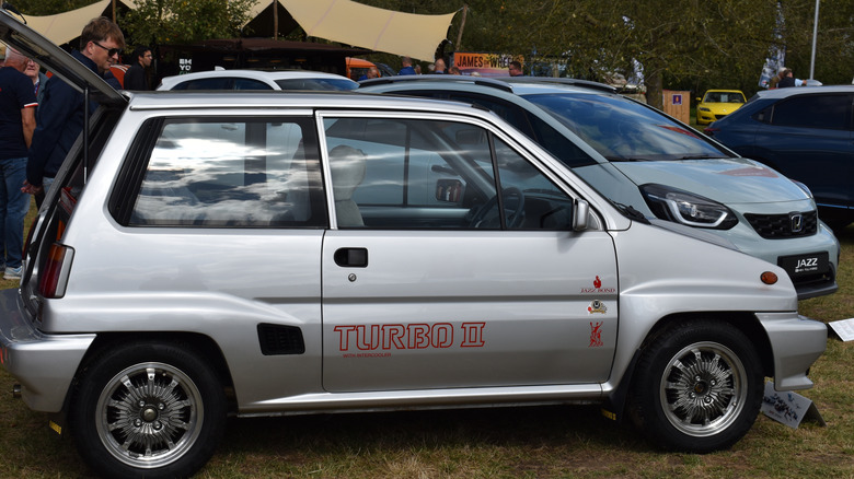 grey Honda city turbo II in profile at car show