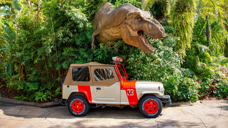 Jurassic Park Jeep in front of dinosaur model