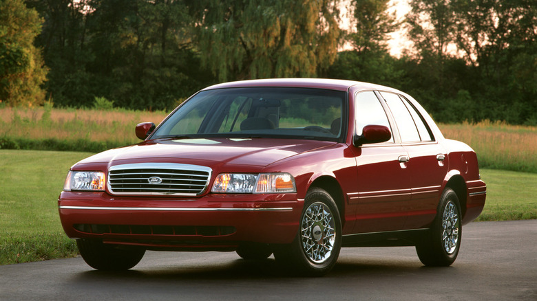 Red 1998 Ford Crown Victoria, front-left three-quarter view
