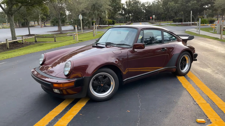 A side on shot of a red 1986 Porsche 911 Turbo