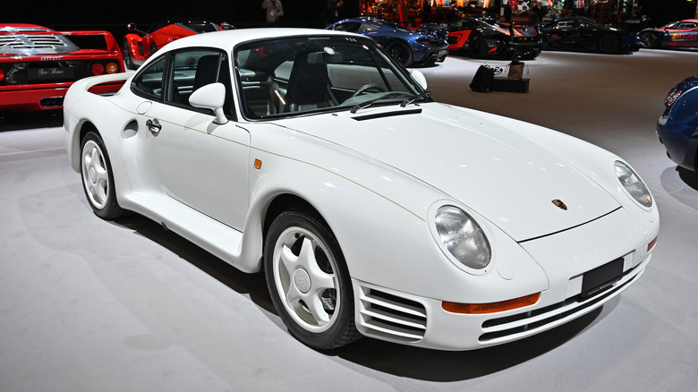 A front-end shot of a white 1987 Porsche 959