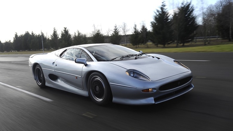 1992 Jaguar XJ220 front 3/4 view driving at speed on wide road