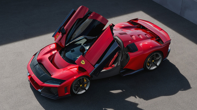 2025 Ferrari F80 hypercar with the scissor doors opened photographed from above front 3/4 view