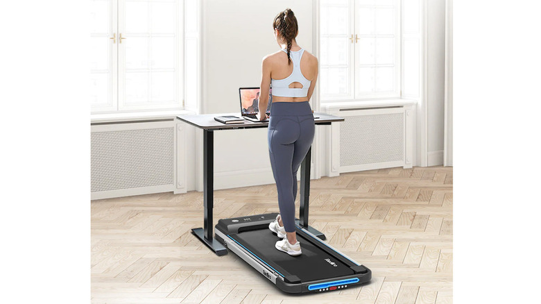 woman working and using Redliro Under Desk Treadmill