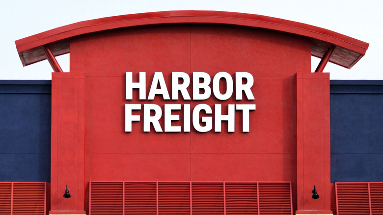 The words "Harbor Freight" written in white on a red storefront