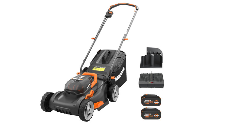 Worx 40V lawn mower next to two batteries and a charger on a white background