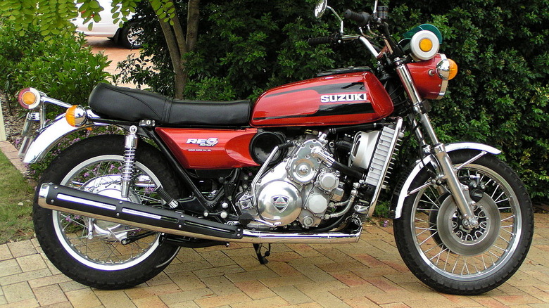 side profile-view of a red Suzuki RE5