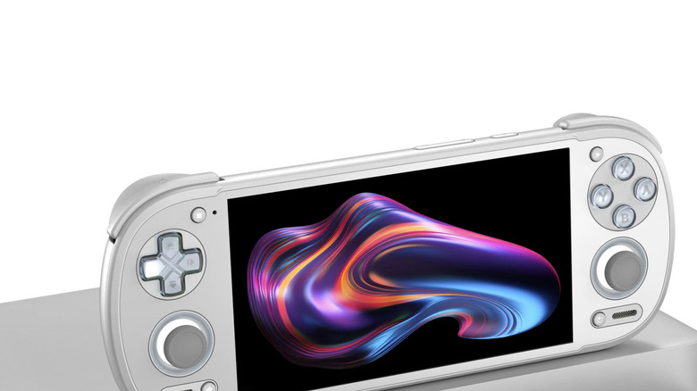 White model Retroid Pocket 6 sitting on a polished metallic surface, white background