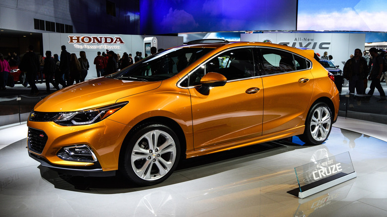Orange 2017 Chevrolet Cruze in a showroom