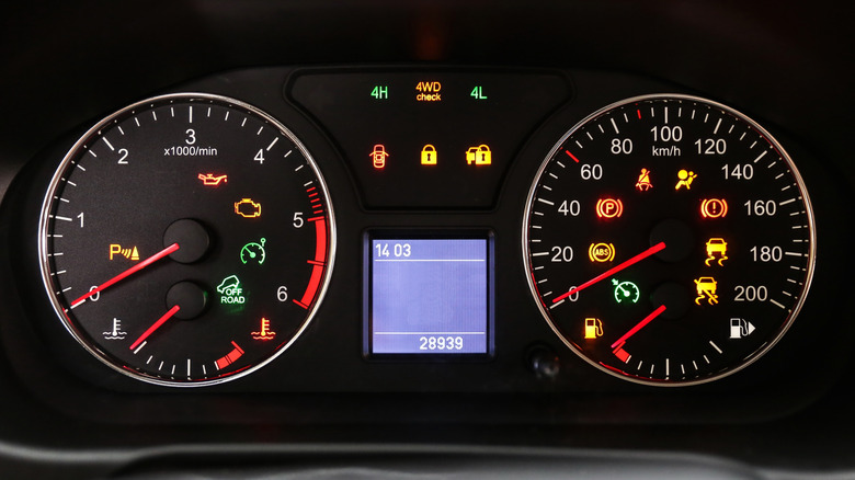 Typical car dashboard with several symbols being displayed