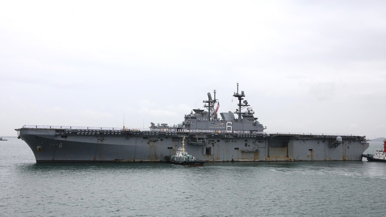 USS America amphibious ship in harbor.