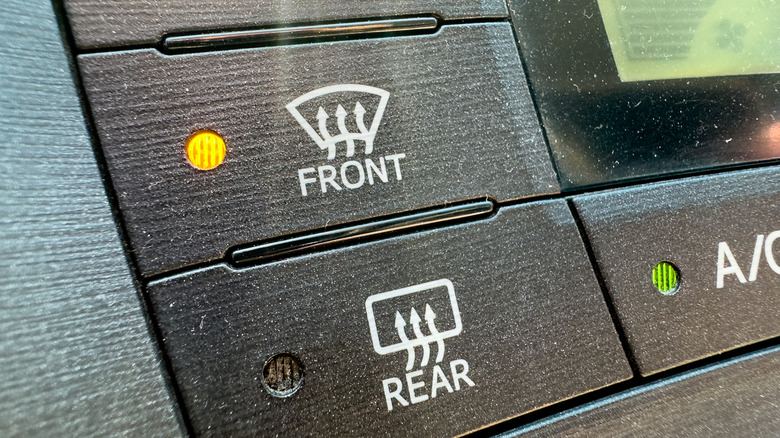 Front and rear defogger buttons of a car