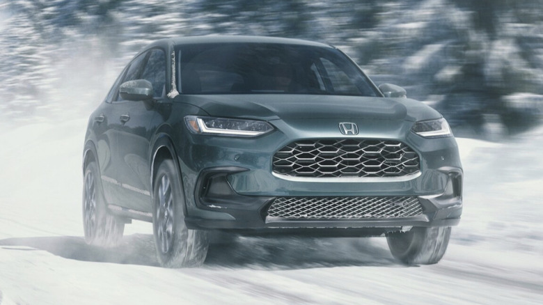 A 2026 Honda HR-V driving on a snowy road