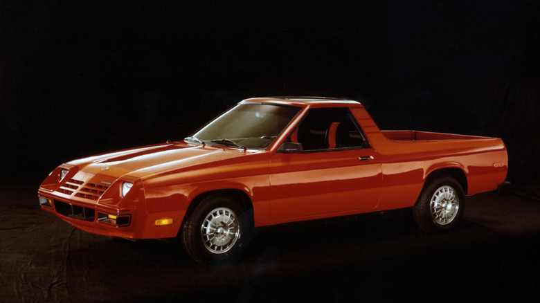 Front 3/4 view of a red Dodge Rampage truck on a black background