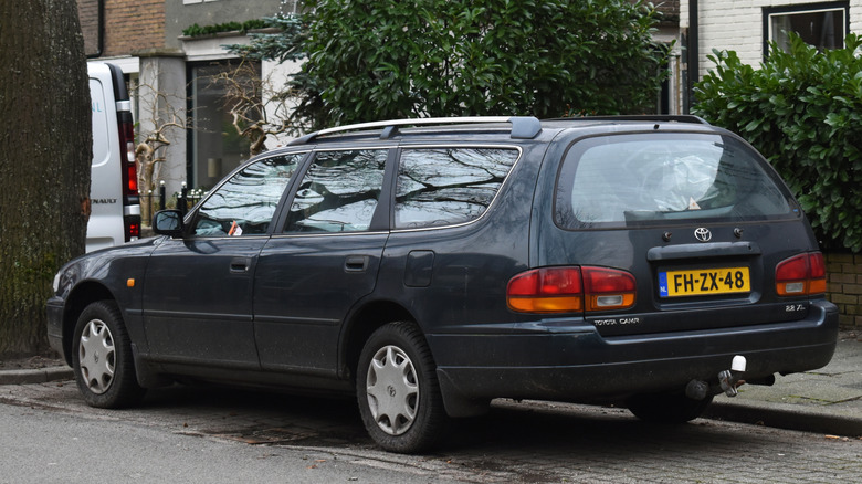 A parked Toyota Camry Wagon, rear 3/4 view