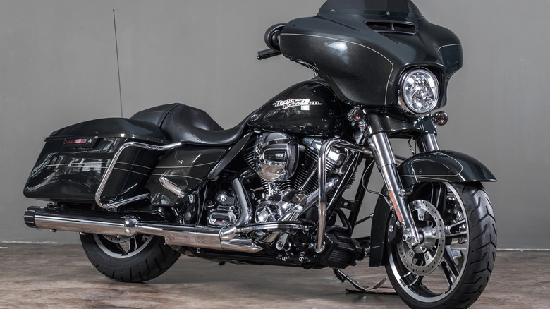 A 2015 Harley Davidson Road Glide from 2015 finished in gray standing inside a building