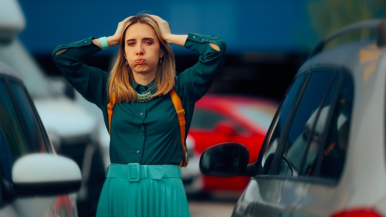 a person attempting to block a parking slot
