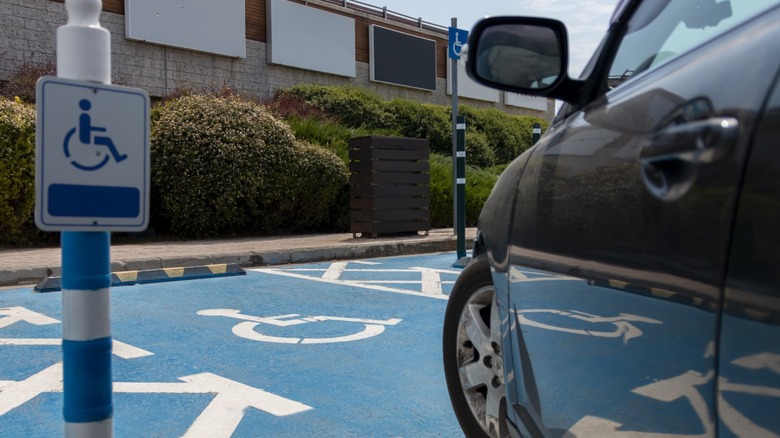 a car pulling into a disabled parking slot