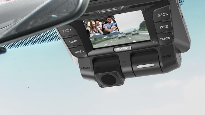 A dash cam on a car showing a family driving.