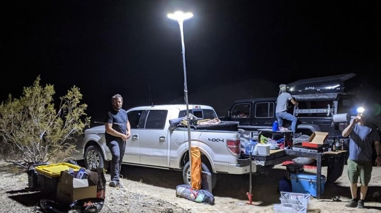 A group of campers with a telescopic camping light