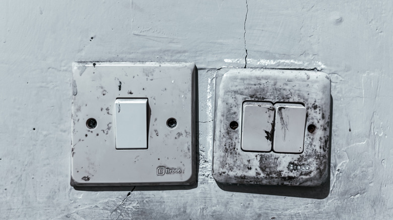 old light switches on a wall