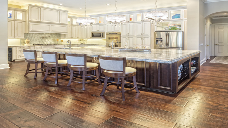 a bunch of can lights installed in a kitchen