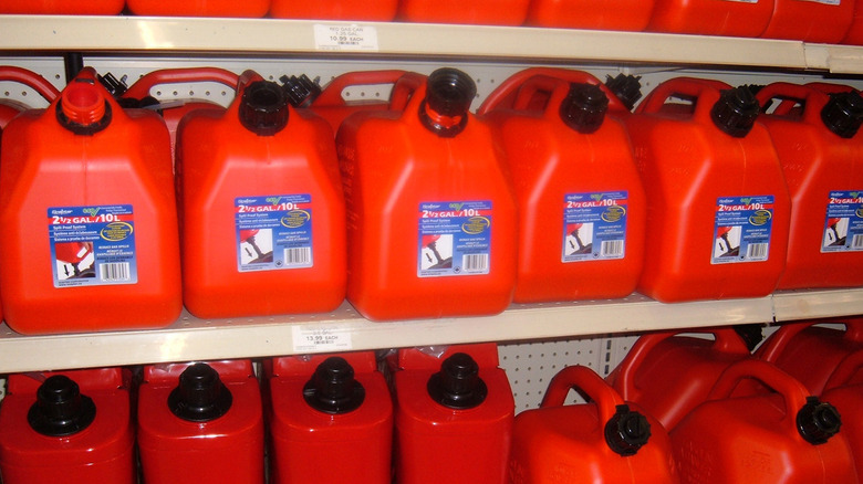 A series of gas containers on a store shelf