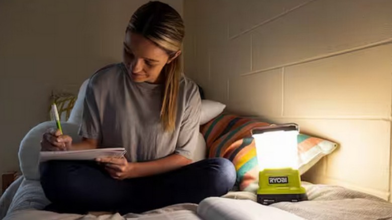 Girl doing homework by Ryobi Area Light