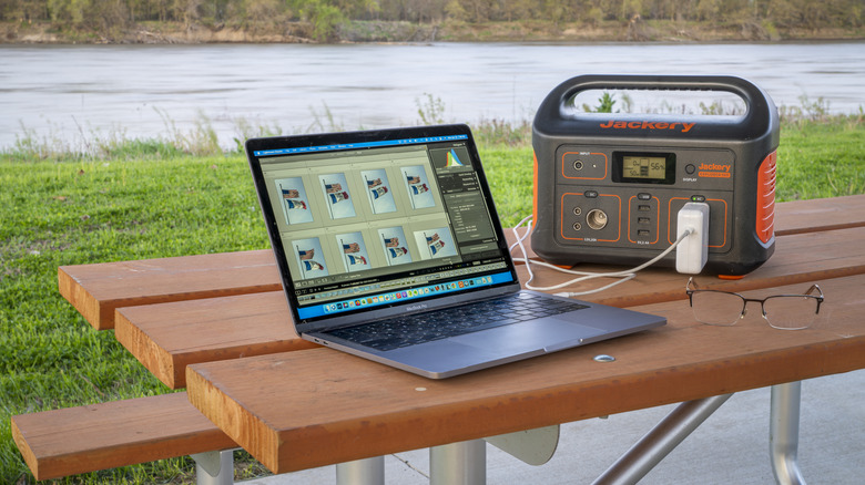 MacBook connected to a Jackery power bank