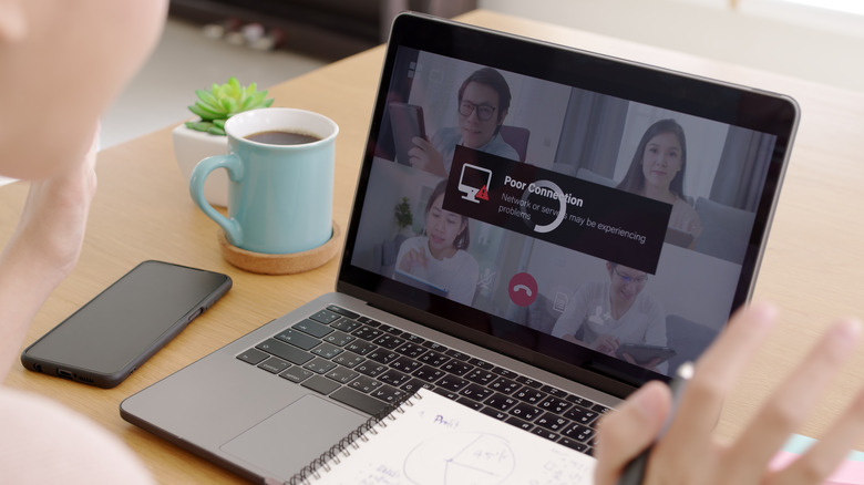 A laptop running a video call with a poor connection.