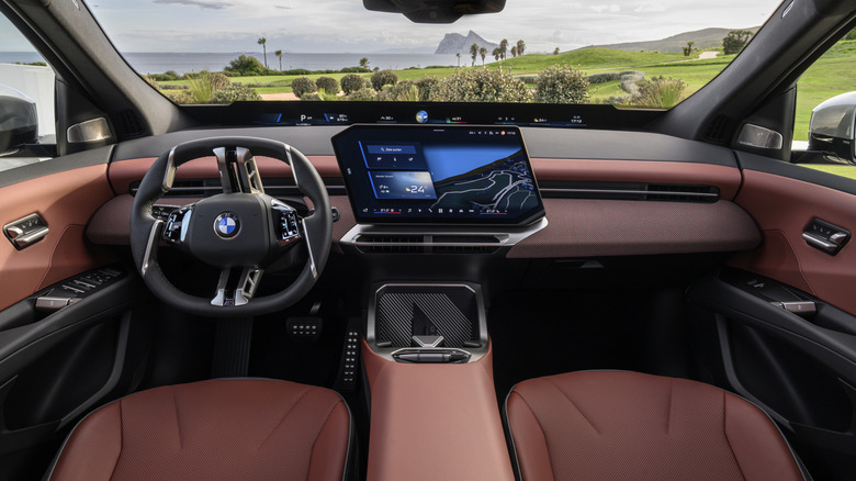 The inside of a BMW with a screen.