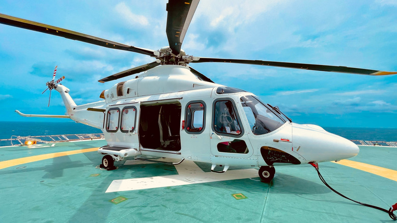 Helicopter on the deck of offshore oil rig