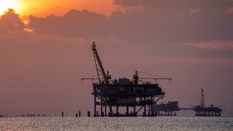 Offshore oil rig at sunset