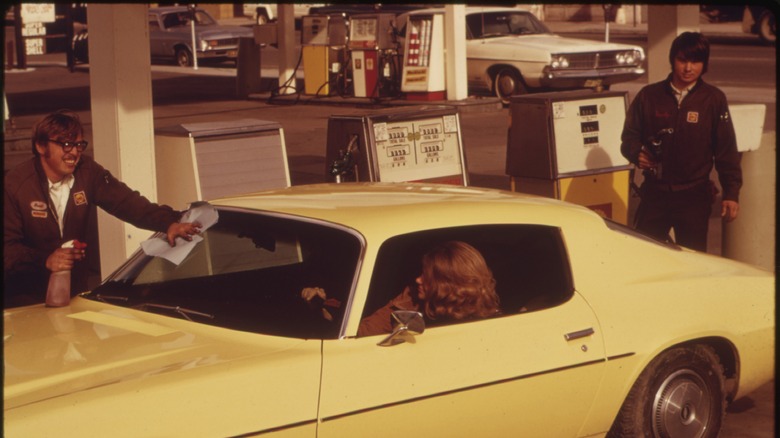 car at 60's gas station