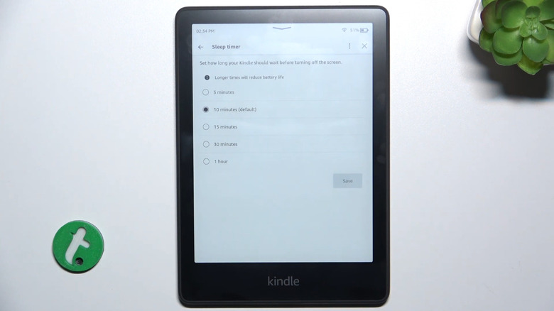 Kindle on table with sleep timer settings