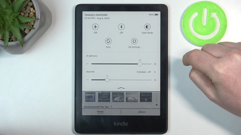person changing color warmth settings on Kindle