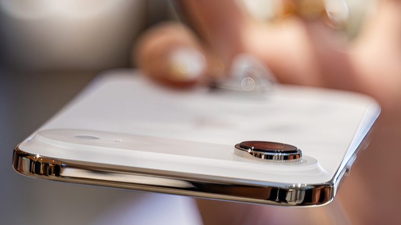 Person holding an iPhone Air