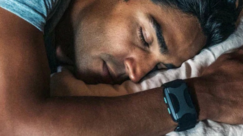 man sleeping with apollo neuro