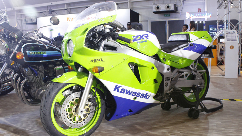 A green and blue Kawasaki Ninja ZX-7R on display