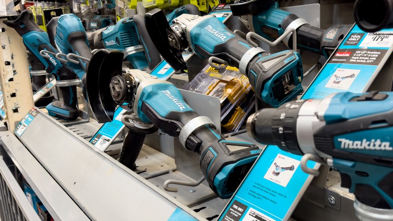 Several Makita power tools on display at a retail store