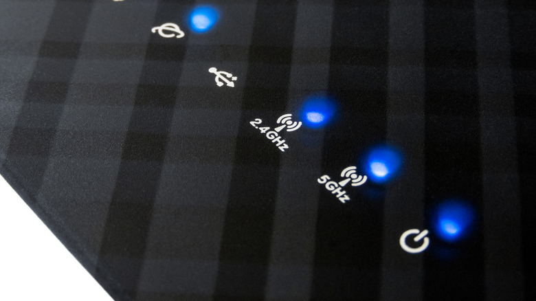 Blinking LEDs on a modern wireless router with 2.4 GHz and 5 GHz bands