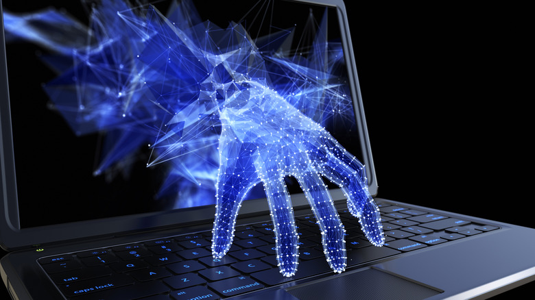 Digital hand reaching through a laptop screen