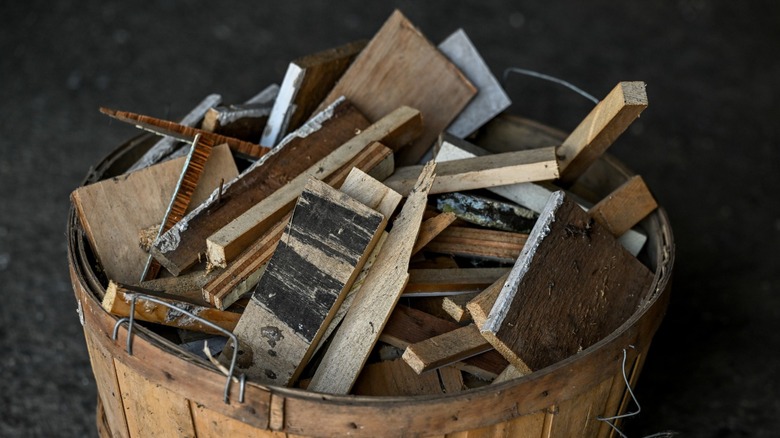 scrap wood in a wooden barrel