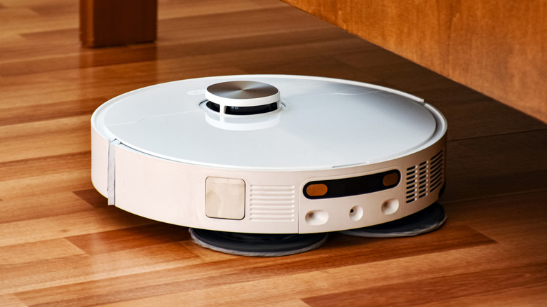 A robot vacuum cleaning an apartment floor